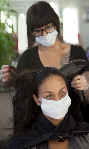 hairdresser wearing face mask